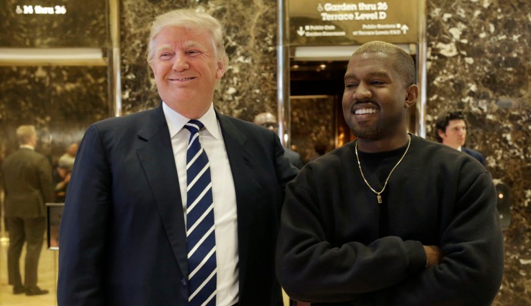 President-elect Donald Trump and Kanye West pose for a picture in the lobby of Trump Tower in New York, Tuesday, Dec. 13, 2016.