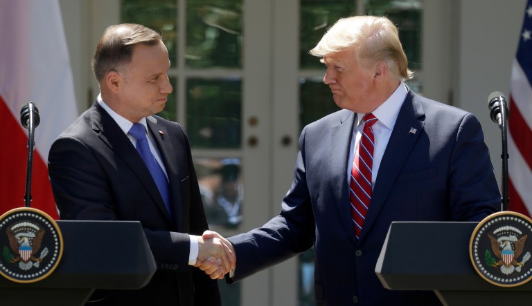President Donald Trump shakes hands with Polish President Andrzej Duda during a news conference in the Rose Garden of the White House, Wednesday, June 12, 2019, in Washington.