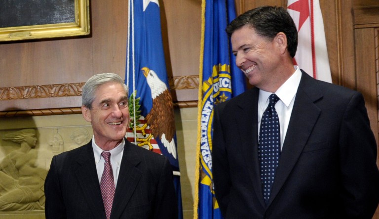 James Comey talks with Robert Mueller.
