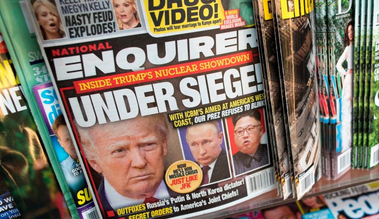 This July 12, 2017, file photo shows the cover of an issue of the National Enquirer featuring President Trump at a store in New York.