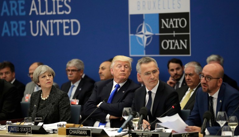 British Prime Minister Theresa May, President  Trump, and NATO Secretary-General Jens Stoltenberg sit at the NATO headquarters on May 25, 2017.