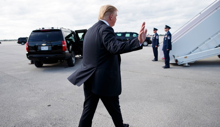 President Donald Trump speaks to media before boarding Air Force One, Sunday, March 24, 2019, at Palm Beach International Airport, in West Palm Beach, Fla., en route to Washington.