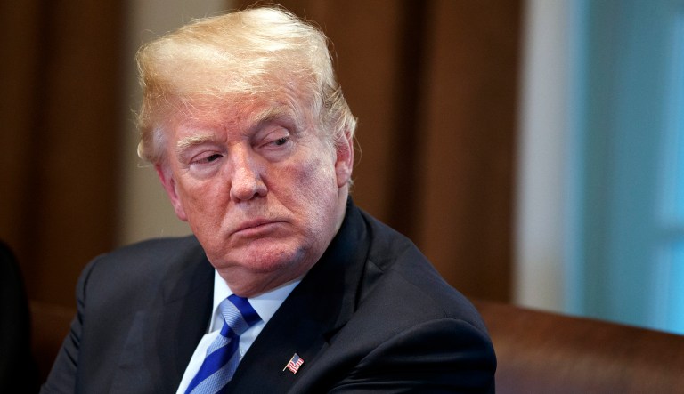 President Donald Trump listens during a roundtable on immigration policy in California, in the Cabinet Room of the White House, Wednesday, May 16, 2018, in Washington.
