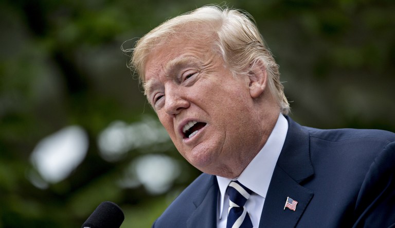 U.S. President Donald Trump speaks before signing S. 2372, the VA Mission Act of 2018, during a ceremony in the Rose Garden of the White House in Washington, D.C., U.S., on Wednesday, June 6, 2018. The bill is targeted at expanding veterans access to private-sector health care.