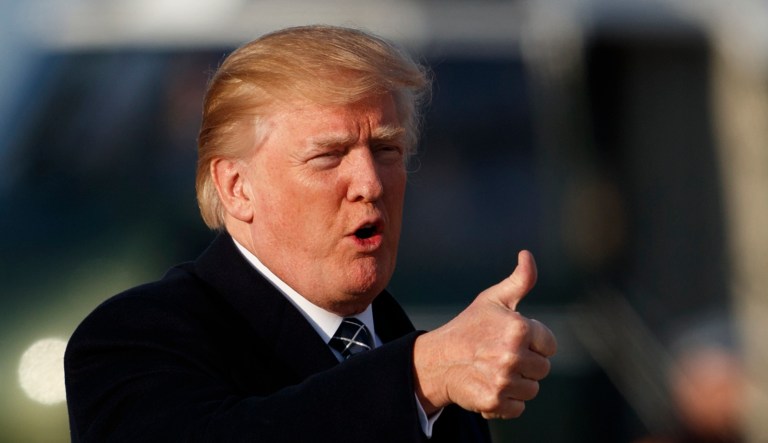 U.S. President Donald Trump gives the thumbs-up as he arrives on Air Force One, Sunday, March 25, 2018, at Andrews Air Force Base, Md., en route to Washington as he returns from Palm Beach, Fla.