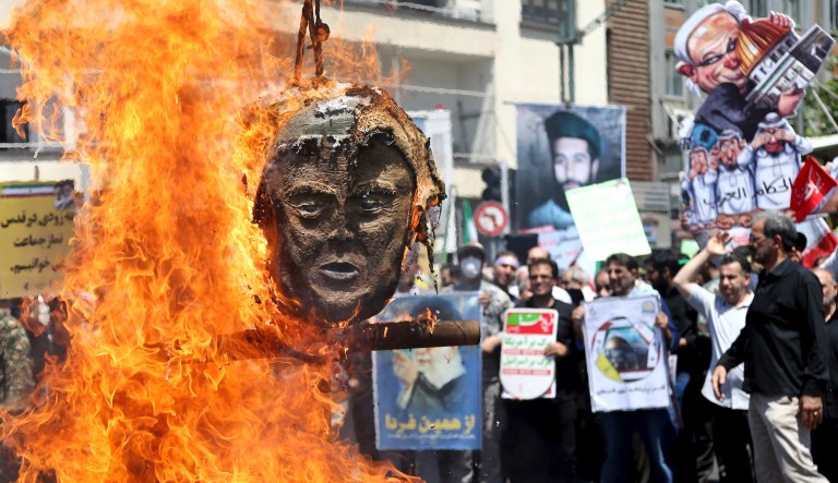 An effigy of the U.S. President Donald Trump is set on fire during the annual anti-Israeli Al-Quds, Jerusalem, Day rally in Tehran, Iran, Friday, June 8, 2018. Iranians attended the rallies across the country to condemn Israeli occupation of Palestinian territories.