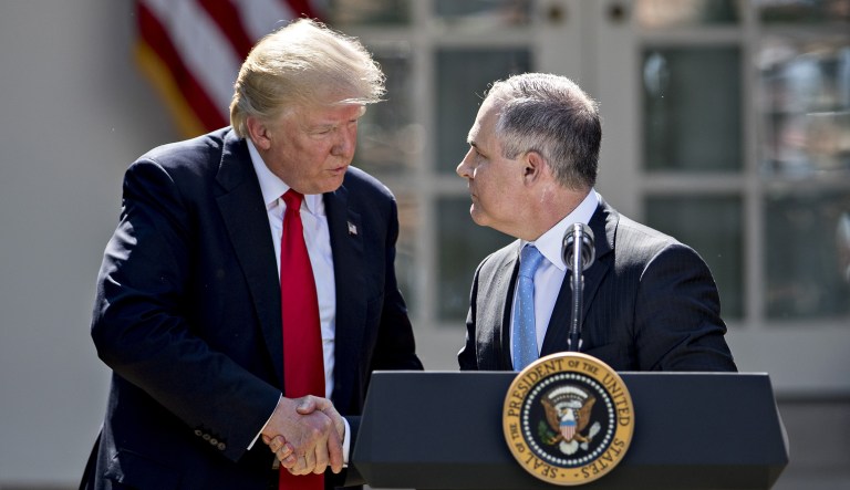 Scott Pruitt, administrator of the Environmental Protection Agency (EPA), right, shakes hands with U.S. President Donald Trump during an announcement in the Rose Garden of the White House in Washington, D.C., U.S., on Thursday, June 1, 2017. Trump announced the U.S. would withdraw from the Paris climate pact and that he will seek to renegotiate the international agreement in a way that treats American workers better.