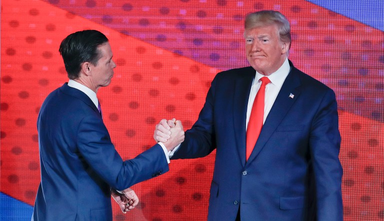 President Donald Trump, right, greets Ralph Reed, left, founder and chairman of the Faith & Freedom Coalition, before speaking at the Faith & Freedom Coalition conference in Washington, Wednesday, June 26, 2019.