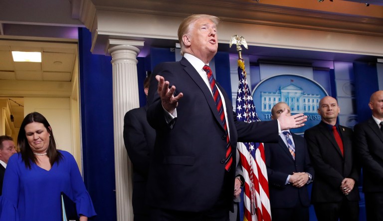 President Donald Trump arrives, followed by press secretary Sarah Huckabee Sanders, arrives to speak in the press briefing room at the White House, Thursday, Jan. 3, 2019, in Washington.