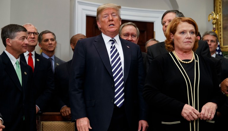 President Donald Trump answers a question about North Korea after signing the "Economic Growth, Regulatory Relief, and Consumer Protection Act," in the Roosevelt Room of the White House, Thursday, May 24, 2018, in Washington.