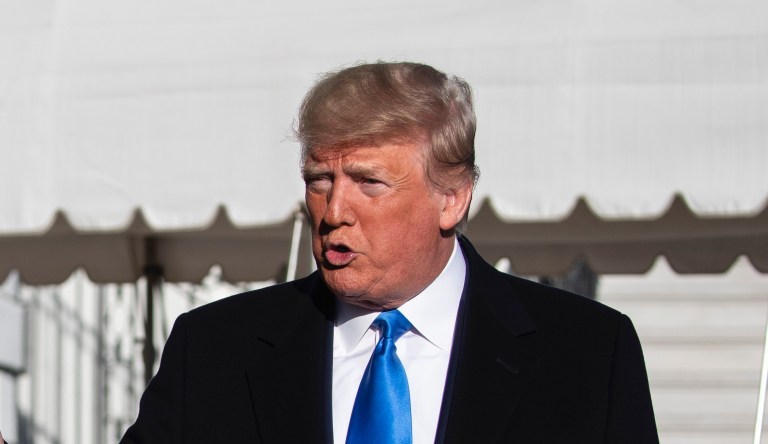 President Donald Trump speaks with reporters before boarding Marine One on the South Lawn of the White House, Saturday, Dec. 7, 2019, in Washington.