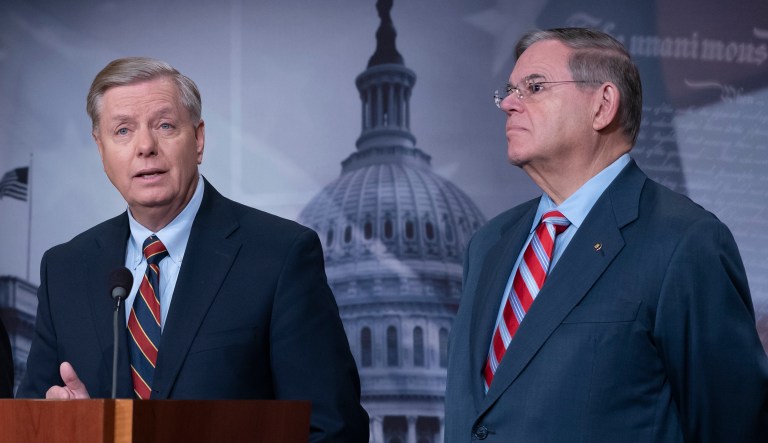 Sen. Lindsey Graham, R-S.C., and Sen. Bob Menendez, D-N.J., attend a news conference at the Capitol in Washington, Thursday, Dec. 20, 2018.