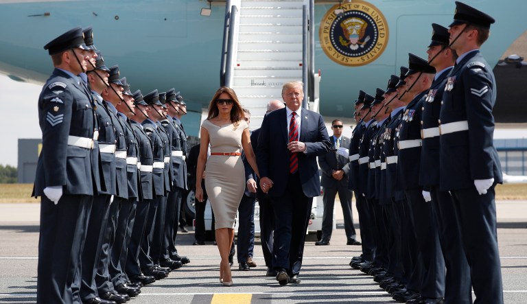 U.S. President Donald Trump and first lady Melania Trump step off Air Force One as they arrive at London's Stansted Airport, Thursday, July 12, 2018.