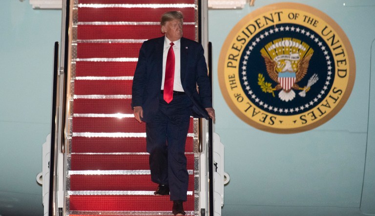 President Donald Trump departs Air Force One early Friday, Oct. 18, 2019, at Andrews Air Force Base, Md. Trump is returning from a campaign rally in Texas.