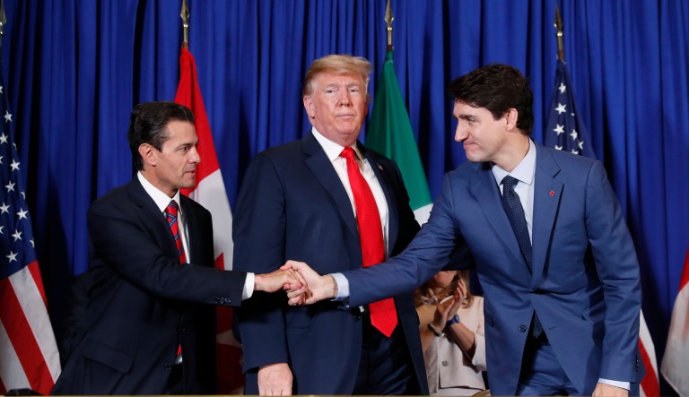 President Donald Trump, Canada's Prime Minister Justin Trudeau, right,  and Mexico's President Enrique Pena Nieto, left, participate in the USMCA signing ceremony, Friday, Nov. 30, 2018 in Buenos Aires, Argentina.