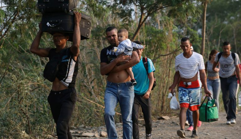 Venezuelans cross illegally into Colombia at a blindspot on the border near the Simon Bolivar International Bridge in Cucuta, Colombia, Tuesday, Feb. 26, 2019. The Trump administration announced new sanctions Monday on allies of Venezuela's Nicolas Maduro as it struggles to find new ways to boost his opponent after an effort to deliver humanitarian aid to the economically devastated nation faltered amid strong resistance from security forces loyal to the socialist leader. 