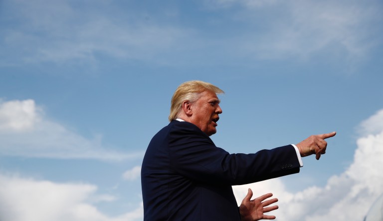 President Donald Trump speaks with reporters before boarding Air Force One at Morristown Municipal Airport in Morristown, N.J., Sunday, Aug. 18, 2019.