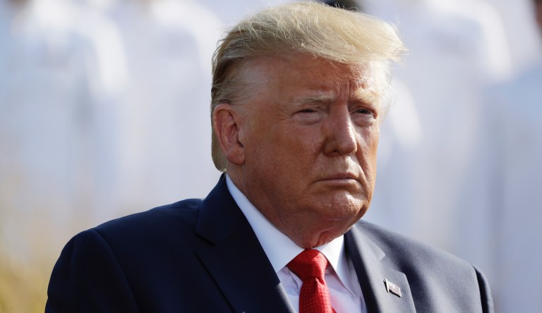 President Donald Trump and first lady Melania Trump participate in a moment of silence honoring the victims of the Sept. 11 terrorist attacks, on the South Lawn of the White House, Wednesday, Sept. 11, 2019, in Washington. 
