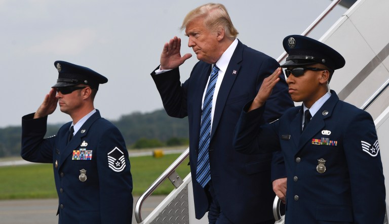 President Donald Trump walks down the steps of Air Force One at Morristown Municipal Airport in Morristown, N.J., Tuesday, Aug. 13, 2019.