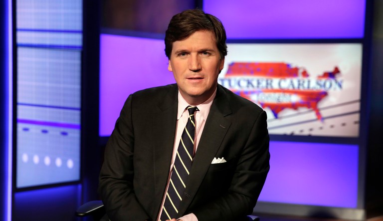 Tucker Carlson, host of "Tucker Carlson Tonight," poses for photos in a Fox News Channel studio, in New York, Thursday, March 2, 2107.