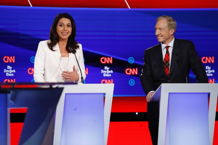 Democratic presidential candidate U.S. Rep. Tulsi Gabbard, D-Hawaii, left, and businessman Tom Steyer participate in a Democratic presidential primary debate hosted by CNN/New York Times at Otterbein University, Tuesday, Oct. 15, 2019, in Westerville, Ohio. 