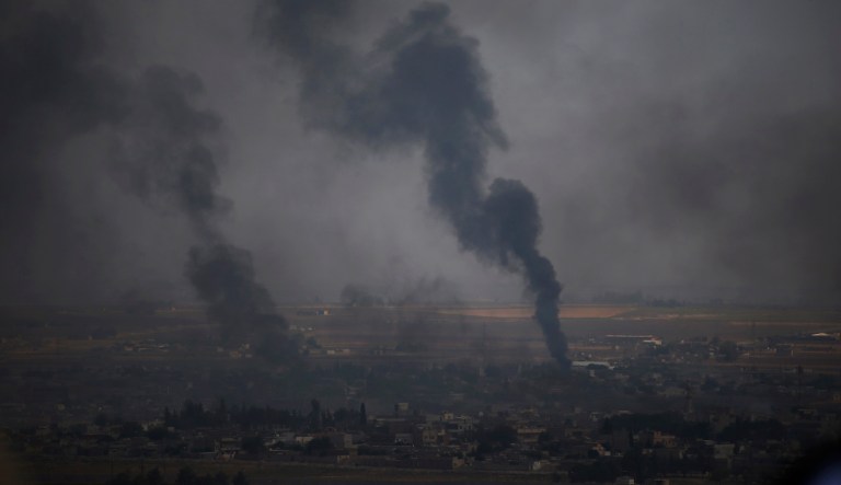 In this photo taken from the Turkish side of the border between Turkey and Syria, in Ceylanpinar, Sanliurfa province, southeastern Turkey, smoke billows from targets in Ras al-Ayn, Syria, during bombardment by Turkish forces, Wednesday, Oct. 16, 2019. (AP Photo/Lefteris Pitarakis)