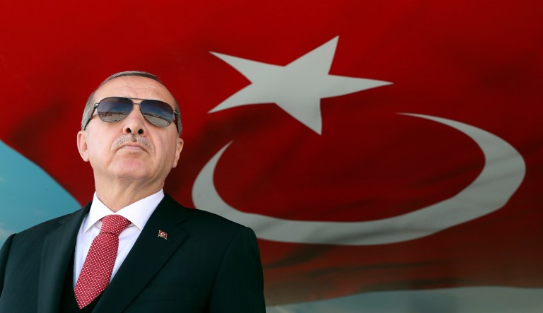 Turkey's President Recep Tayyip Erdogan attends a military ceremony honoring new commandos, in Isparta, Turkey, Friday, Oct. 12, 2018. Erdogan is suggesting that Turkey's military could soon launch a new operation across the border into northern Syria, in zones held by Syrian Kurdish fighters.