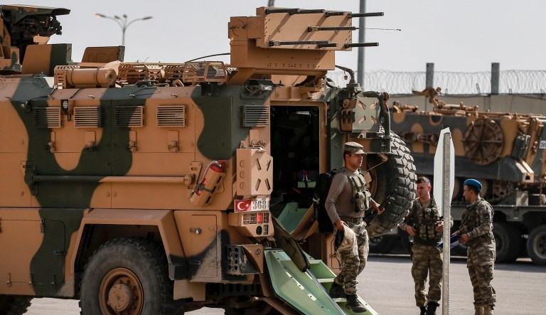 Turkish soldiers prepare to enter Syria with an armoured personnel carrier at the border with Syria in Karkamis, Gaziantep province, southeastern Turkey, Tuesday, Oct. 15, 2019. 