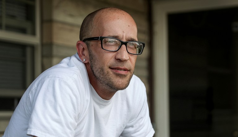 IN this Aug. 13, 2018, file photo, Tyson Timbs poses for a portrait at his aunt's home in Marion, Ind. Five years ago, Timbs had his $42,000 Land Rover taken by the government in a process known as "civil asset forfeiture," after he pled guilty to selling $260 of heroin.