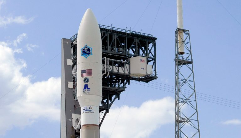 A United Launch Alliance Atlas V rocket stands ready at launch complex 41at the Cape Canaveral Air Force Station with a payload of a high Frequency satellite Wednesday, March 25, 2020, in Cape Canaveral, Fla. The launch is scheduled for Thursday afternoon.