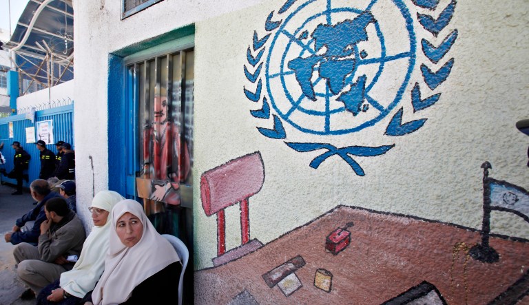 Palestinian refugees attend a protest demanding resumption of food distribution to the refugees, outside the offices of the United Nations Relief and Works Agency (UNRWA), in Gaza City, Monday, April 15, 2013. The UNRWA has halted rations and monthly cash allocated for poor families of Palestinian refugees which from April 1 due to budget cuts.