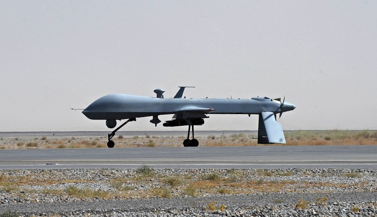 FILE - In this June 13, 2010, file photo a U.S. Predator unmanned drone armed with a missile stands on the tarmac of Kandahar military airport in Afghanistan. Hunting al-Qaida targets from Pakistan to Afghanistan, Yemen to Somalia, the fleet of U.S. armed Predator and Reaper drones that killed two American members of al-Qaida in Yemen Friday, Sept. 30, 2011, are the night stalkers of the expanded U.S. war on terrorists.