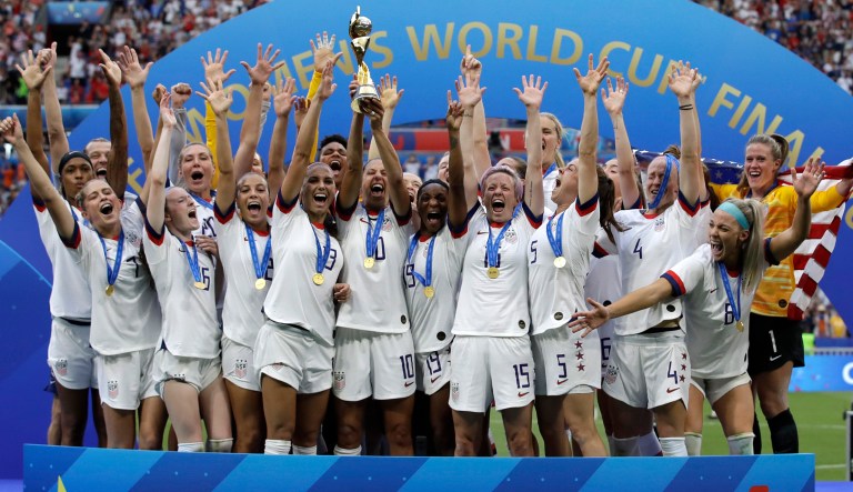 United States' team celebrates with trophy after winning the Women's World Cup final soccer match between US and The Netherlands at the Stade de Lyon in Decines, outside Lyon, France, Sunday, July 7, 2019.