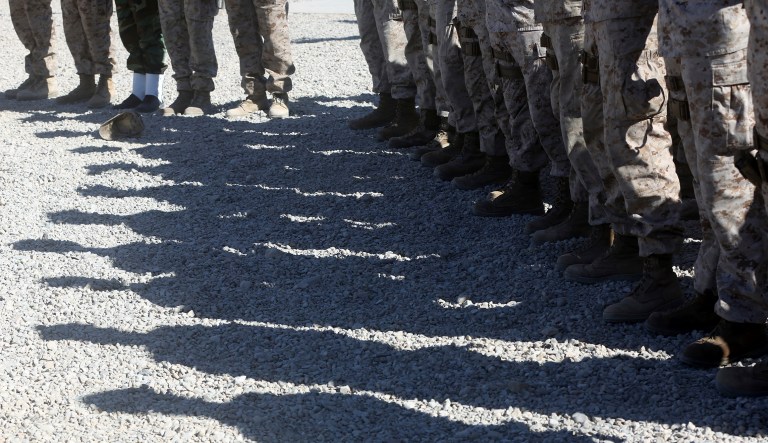 U.S. Marines stand guard during the change of command ceremony at Task Force Southwest military field in Shorab military camp of Helmand province, Afghanistan, Monday, Jan. 15, 2018.