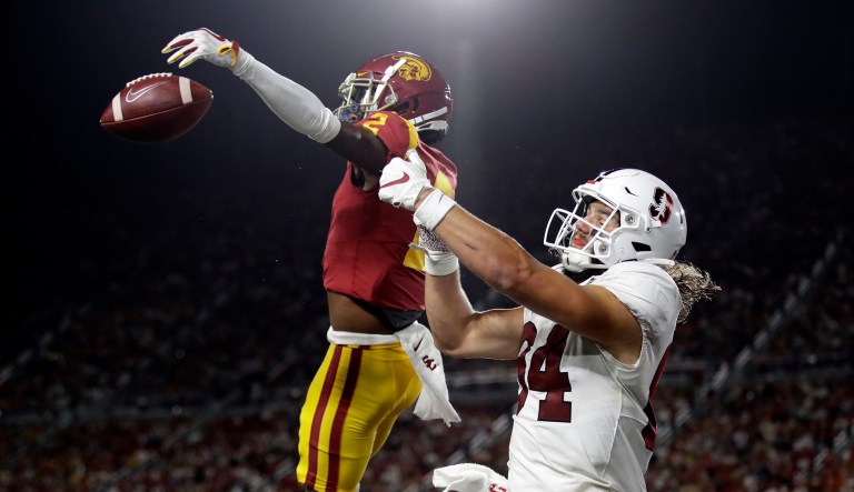 Southern California cornerback Olaijah Griffin, left,  breaks up a pass in the end zone intended for Stanford tight end Colby Parkinson during the first half of an NCAA college football game Saturday, Sept. 7, 2019, in Los Angeles.