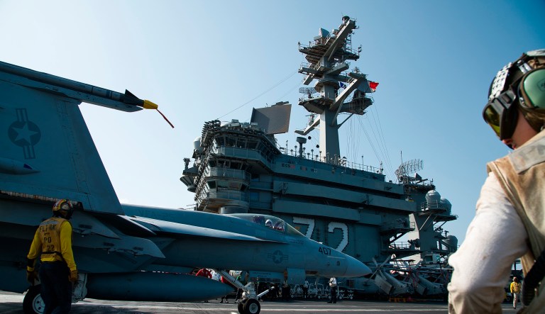 An F/A-18 fighter jet taxis on the deck of the USS Abraham Lincoln aircraft carrier in the Arabian Sea, Monday, June 3, 2019.