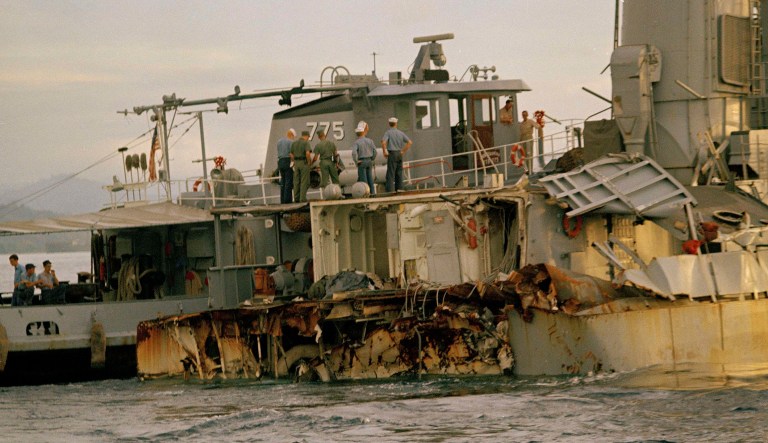 Sailors inspect damage to the U.S. Navy destroyer USS Frank E. Evans after it was cut in half in a collision with the light aircraft carrier HMAS Melbourne of the Royal Australian Navy in the South China Sea, 650 miles southwest of Manila, June 3, 1969.