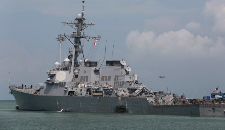 The USS John S. McCain is moored pier side at Changi naval base in Singapore following a collision with the merchant vessel Alnic MC Monday, Aug. 21, 2017.