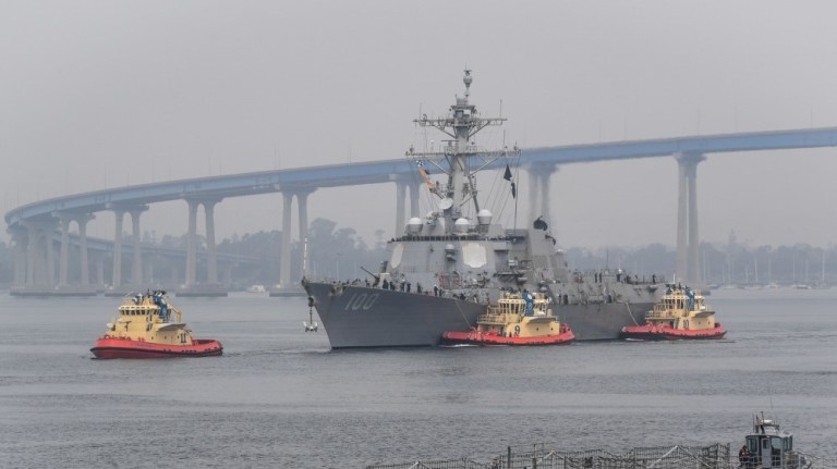 The guided-missile destroyer USS Kidd arrives in San Diego April 28 as part of the Navyâs aggressive response to the COVID-19 outbreak on board the ship. While in San Diego, the Navy will provide medical care for the crew and clean and disinfect the ship.