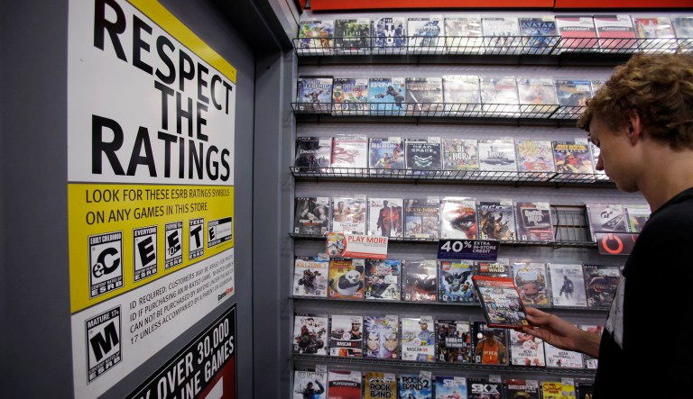 Jack Schooner, 16, looks at Grand Theft Auto video game at GameStop in Palo Alto, Calif., Monday, June 27, 2011.