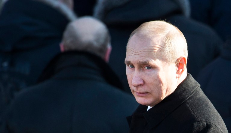 Russian President Vladimir Putin attends a wreath-laying ceremony at the Tomb of the Unknown Soldier in Moscow, Russia.