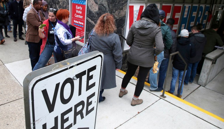 People line up to vote on the last day of early voting at the Minneapolis Early Vote Center Monday, Nov. 5, 2018, in Minneapolis. 
