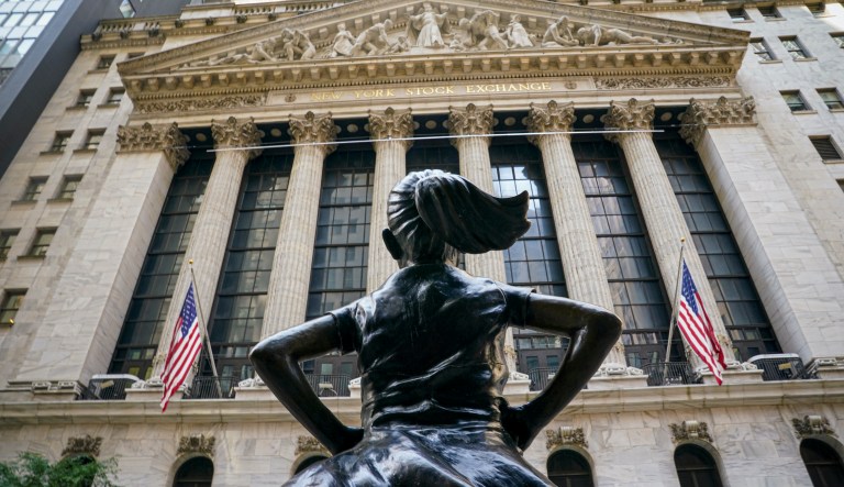 Dow Jones erases most pandemic losses and finishes up on the year