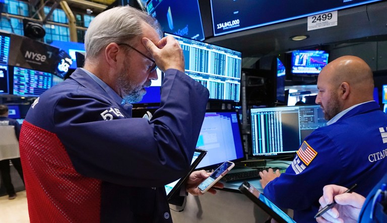 Trader David O'Day, left, and specialist John Parisi work on the floor of the New York Stock Exchange, Wednesday, Sept. 13, 2023. Stocks are churning in place on Wall Street after a highly anticipated report showed inflation accelerated across the country last month, but not by much more than expected.