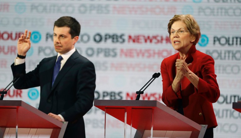 Democratic presidential candidate Sen. Elizabeth Warren, D-Mass., right, speaks beside South Bend Mayor Pete Buttigieg during a Democratic presidential primary debate Thursday, Dec. 19, 2019, in Los Angeles.
