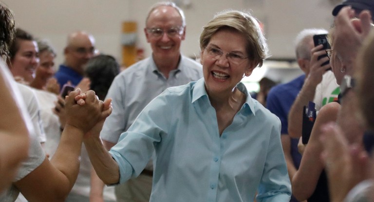 Democratic presidential candidate Sen. Elizabeth Warren, D-Mass., greets people as she arrives at a campaign event in Derry, N.H. (AP Photo/Elise Amendola)