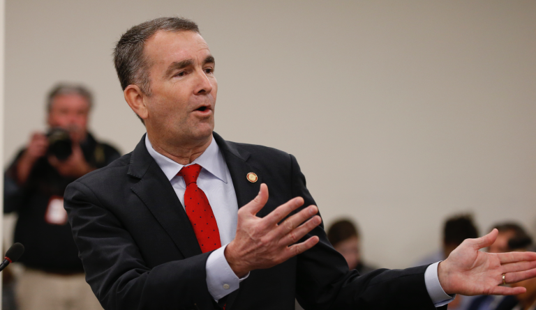 Virginia Gov. Ralph Northam, gestures as he delivers his budget briefing before a meeting of the House Appropriations Committee and the Senate Finance Committee at the Capitol in Richmond, Va., Tuesday, Dec. 17, 2019. (AP Photo/Steve Helber)