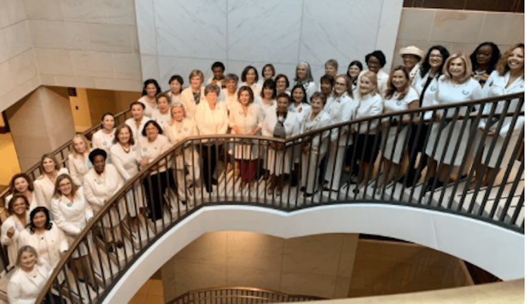 House Democratic women wearing suffragette white at Trump State of the Union