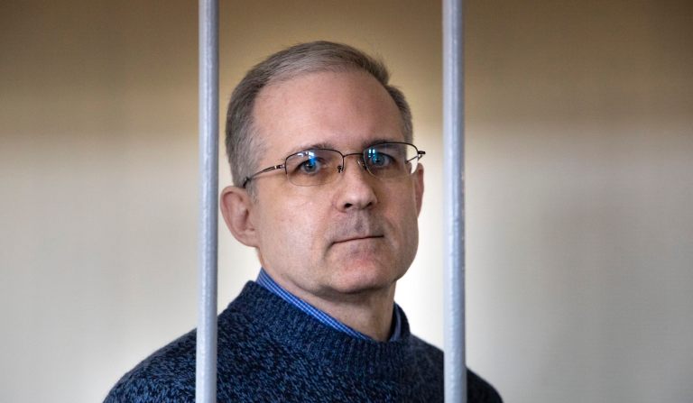 Paul Whelan, a former U.S. marine, who was arrested for alleged spying in Moscow at the end of 2018, stands in a cage while waiting for a hearing in a court room in Moscow, Russia, Friday, Aug. 23, 2019. 