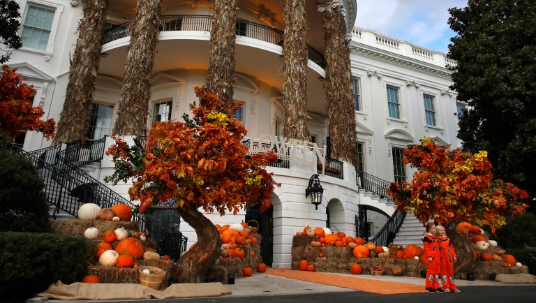 Trumps hand out candy to costumed kids for their second Halloween event at White House